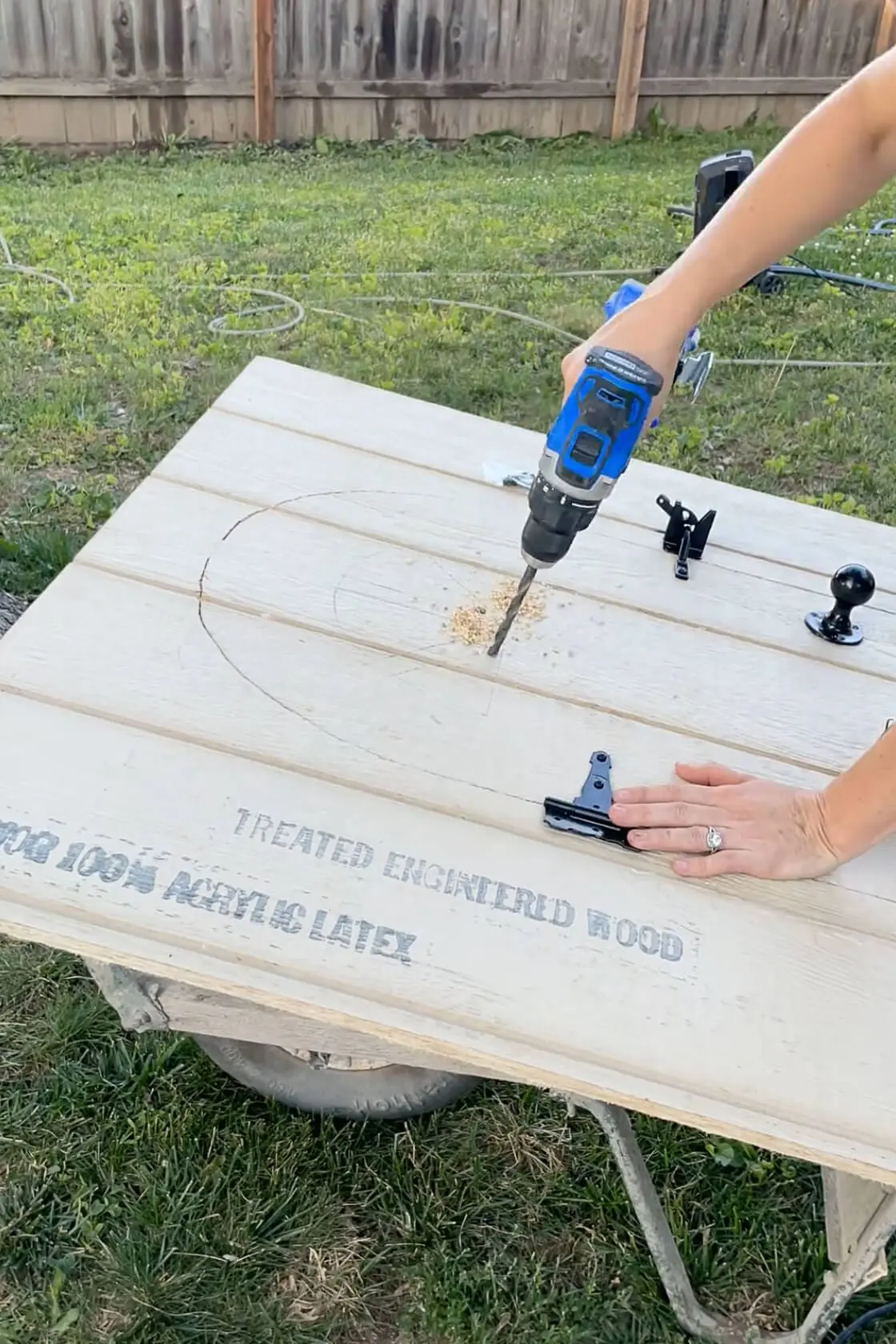 Using a drill to start a hole for a jig saw.